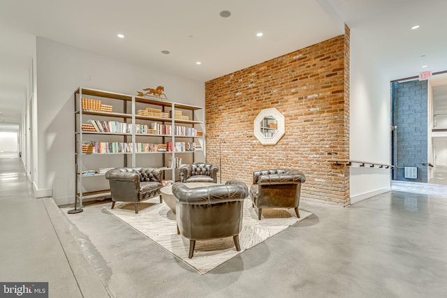 sitting room with brick wall