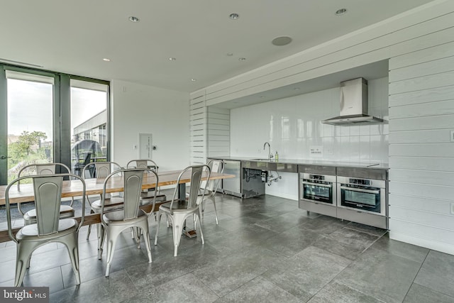 57 N St NW Unit 433, Washington, DC 20001 - dining area with recessed lighting, floor to ceiling windows, and wooden walls