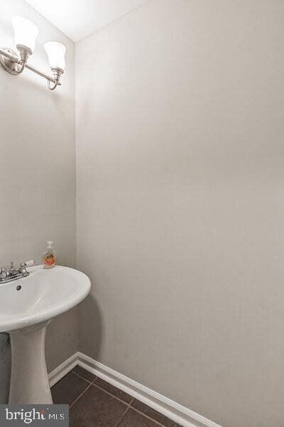 bathroom with tile patterned flooring and sink