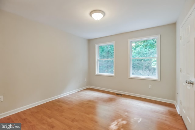 unfurnished room featuring light wood-type flooring