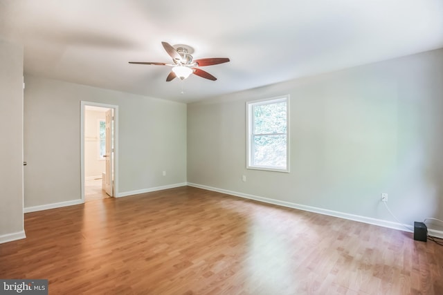 spare room with ceiling fan and light hardwood / wood-style floors