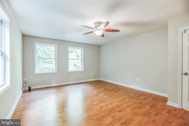 spare room featuring ceiling fan and light wood-type flooring