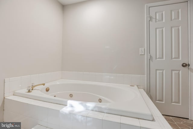 bathroom with tiled bath