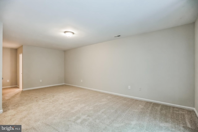 spare room with light carpet