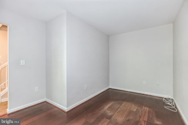 empty room featuring dark hardwood / wood-style floors