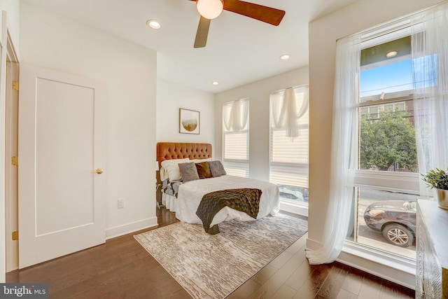 bedroom featuring dark hardwood / wood-style floors and ceiling fan