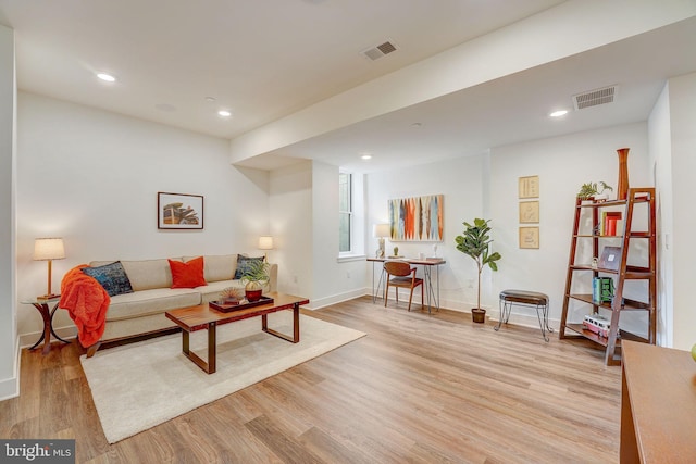 living room with light hardwood / wood-style floors