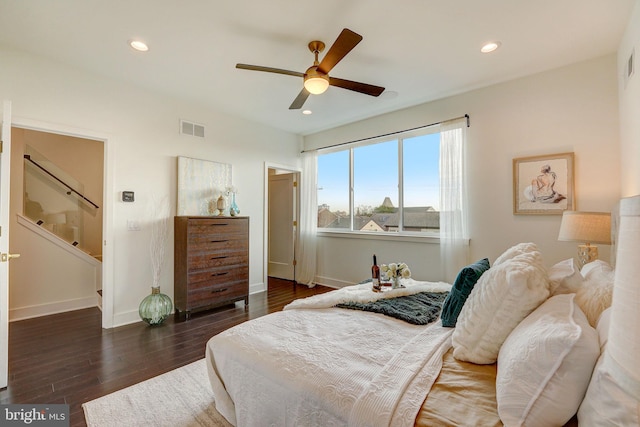 bedroom featuring ceiling fan and dark hardwood / wood-style floors