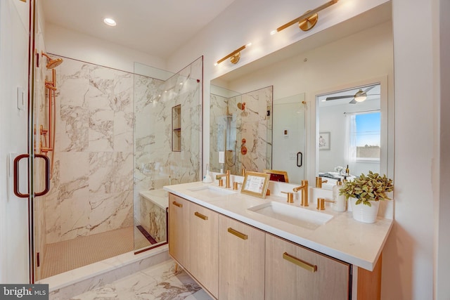 bathroom featuring vanity, ceiling fan, and a shower with shower door