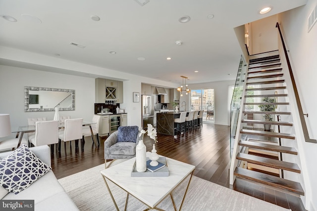 living room featuring dark wood-type flooring and wine cooler