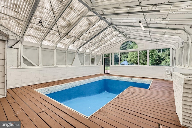 view of swimming pool with a wooden deck