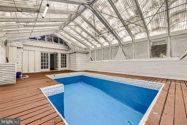 view of swimming pool featuring a wooden deck