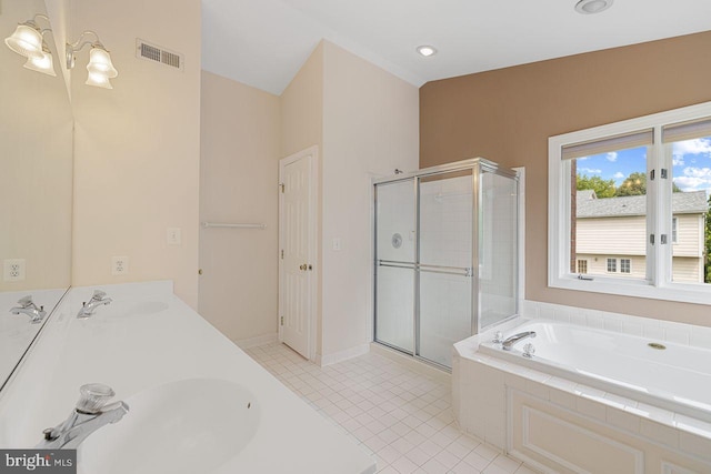 bathroom with vanity, shower with separate bathtub, and tile patterned flooring