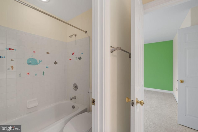 bathroom with toilet and bathtub / shower combination