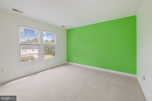 unfurnished room with carpet floors