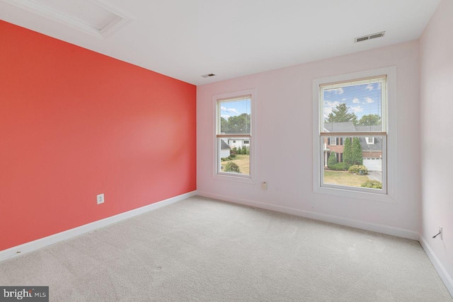 carpeted empty room with plenty of natural light