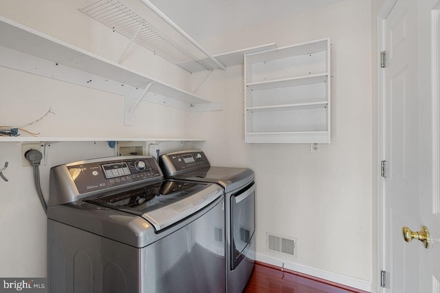 laundry area with washer and clothes dryer