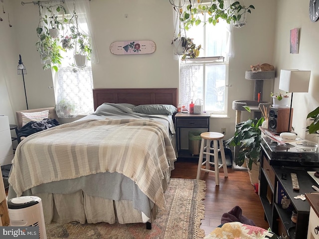 bedroom featuring dark hardwood / wood-style flooring