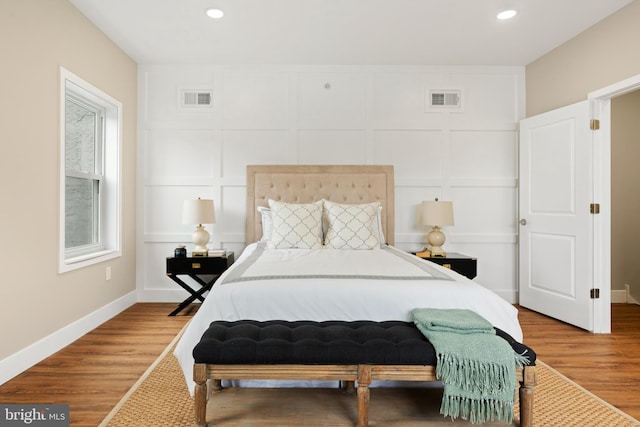 bedroom featuring hardwood / wood-style flooring