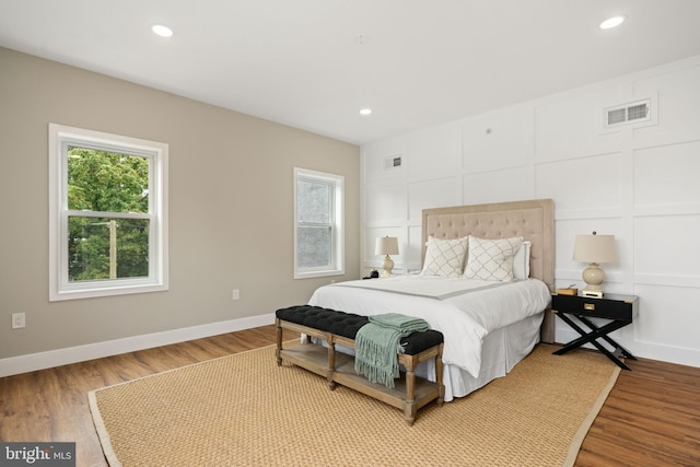 bedroom with hardwood / wood-style floors