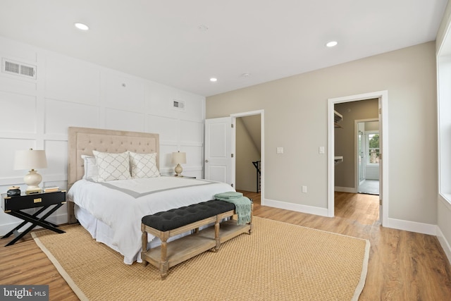 bedroom with hardwood / wood-style floors