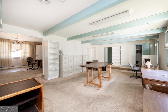 carpeted home office featuring a notable chandelier and beamed ceiling