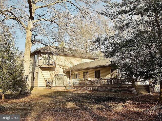 rear view of property with a deck