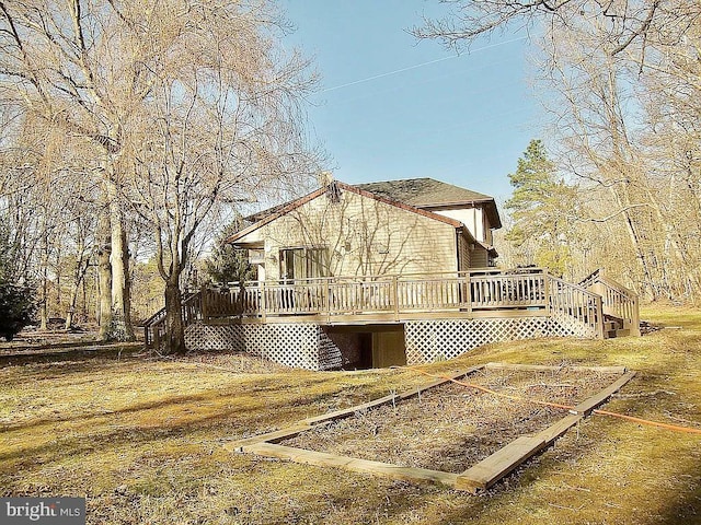 view of side of property with a deck