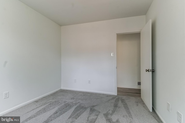 unfurnished room featuring carpet flooring