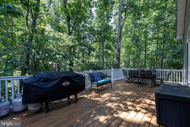 wooden deck featuring grilling area