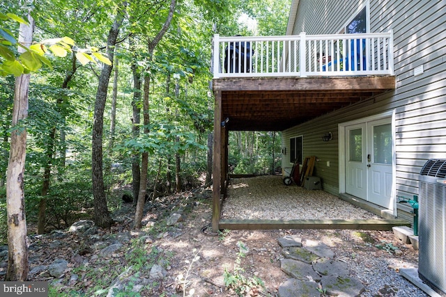 view of patio featuring a balcony and central AC