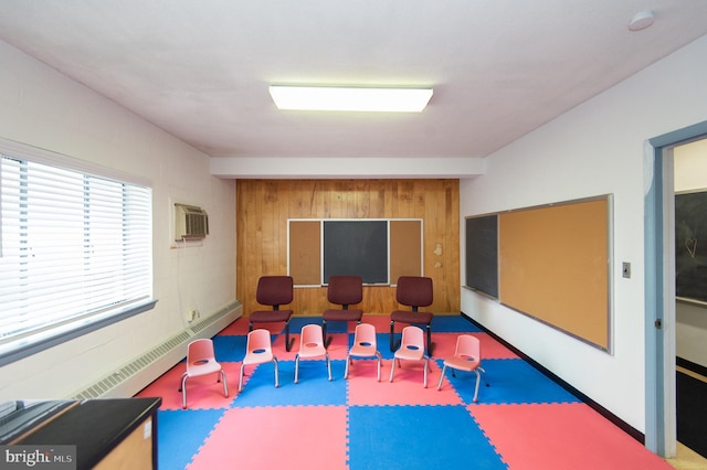 rec room with a baseboard radiator