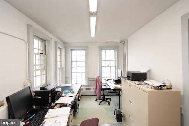 carpeted office with radiator heating unit