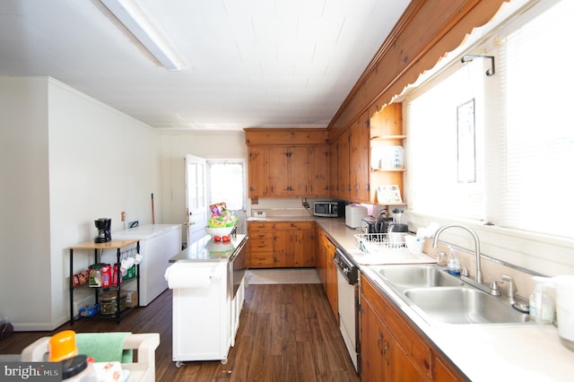 kitchen featuring sink, a center island, dark hardwood / wood-style flooring, crown molding, and dishwashing machine