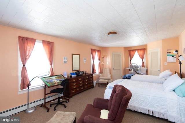 bedroom with carpet floors and a baseboard radiator