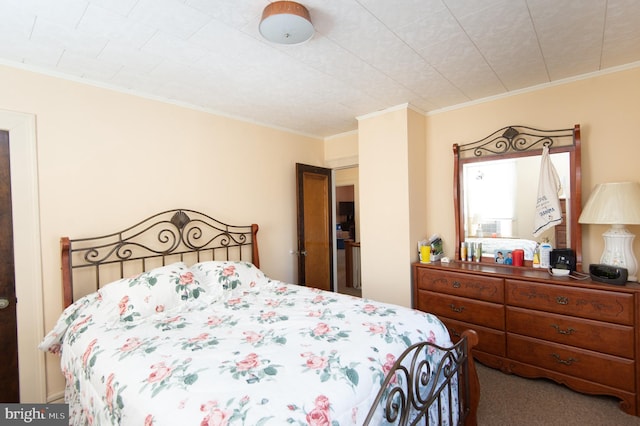 bedroom featuring carpet and crown molding