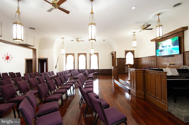 home theater featuring ceiling fan and dark wood-type flooring