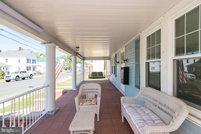 view of patio featuring a porch