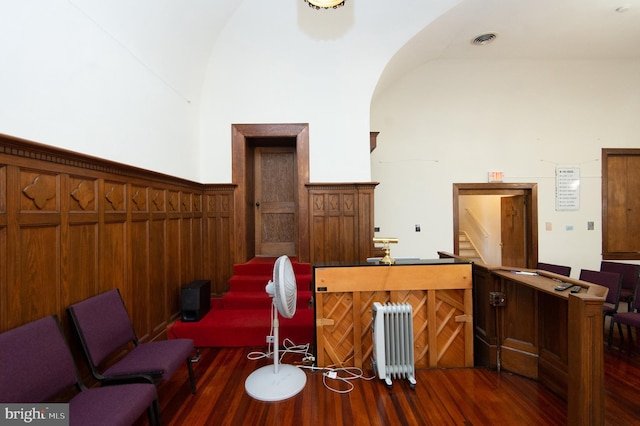 interior space featuring radiator and dark hardwood / wood-style flooring