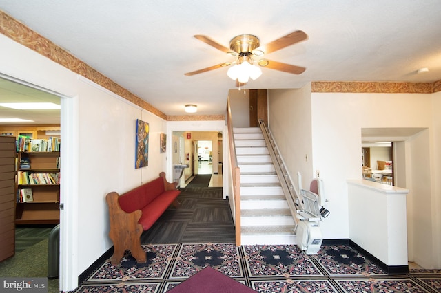 stairs with ceiling fan