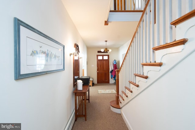 foyer featuring carpet and a chandelier