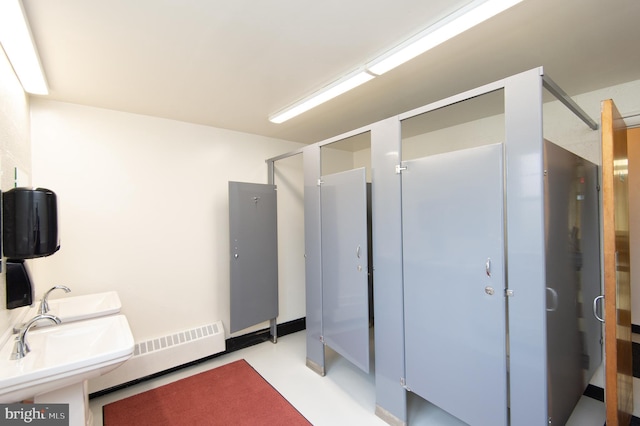 bathroom featuring a baseboard heating unit