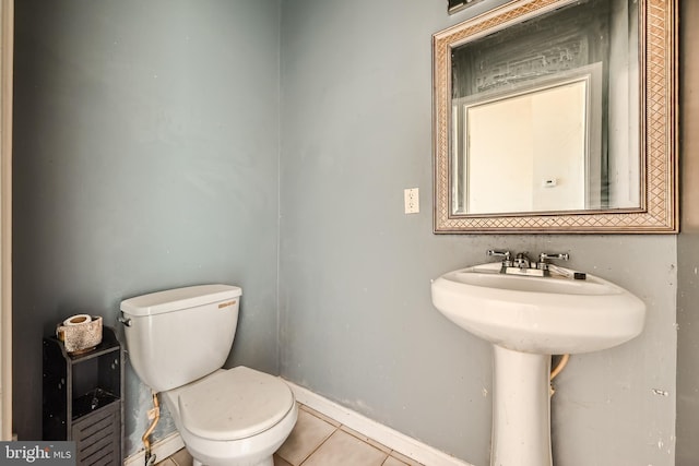 bathroom featuring tile patterned floors and toilet