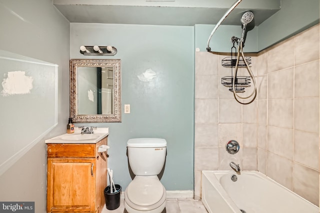 full bathroom with vanity, tiled shower / bath combo, toilet, and tile patterned floors