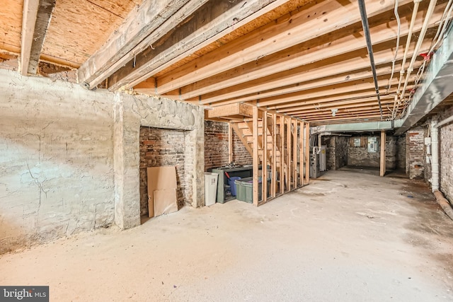 basement with brick wall