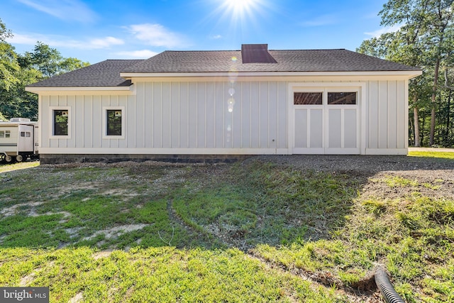 view of property exterior with a yard