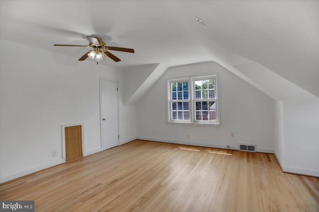 additional living space featuring ceiling fan, vaulted ceiling, and light hardwood / wood-style flooring