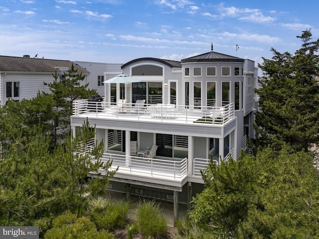 back of house with a balcony