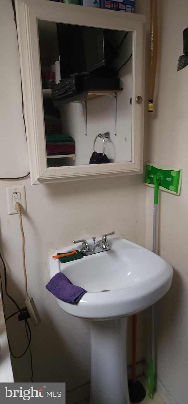 bathroom with tile patterned flooring and toilet