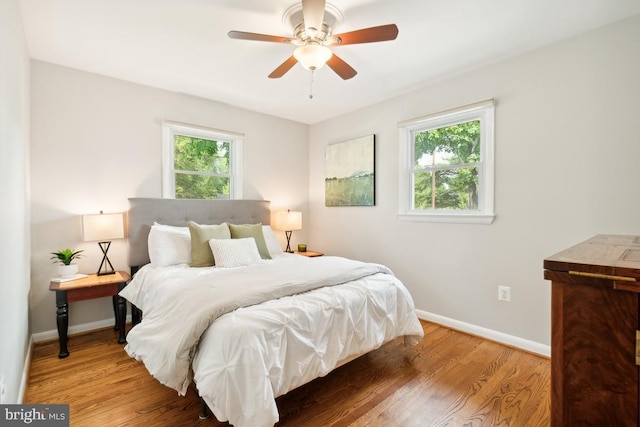 bedroom featuring ceiling fan and hardwood / wood-style floors